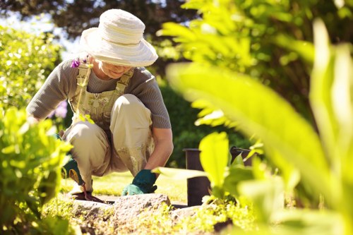 Inspector assessing garden maintenance work on site